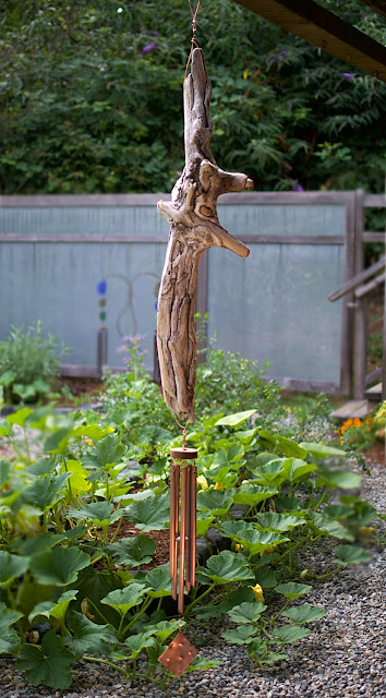 Natural driftwood wind chime, large, outdoors, five copper chimes.
