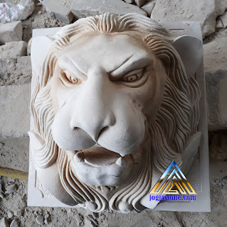 patung air mancur kepala macan dibuat dari batu alam atau batu putih asal gunungkidul