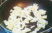 Making scrambled eggs for chicken fried rice recipe