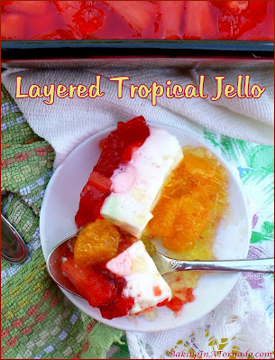 Layered Tropical Jello, a refreshing summer treat. Simple to assemble, but requires time for the layers to set so make this one a day ahead. | Recipe developed by www.BakingInATornado.com | #recipe #dessert
