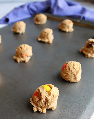 balls of triple peanut butter cookie dough on baking sheet ready to go in oven