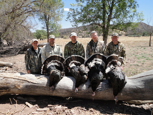 proud hunters with their big goulds turkeys with Colburn and Scott Outfitters