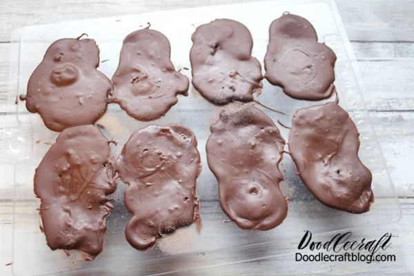 Let the chocolate set completely and remove the frogs from the mold.
