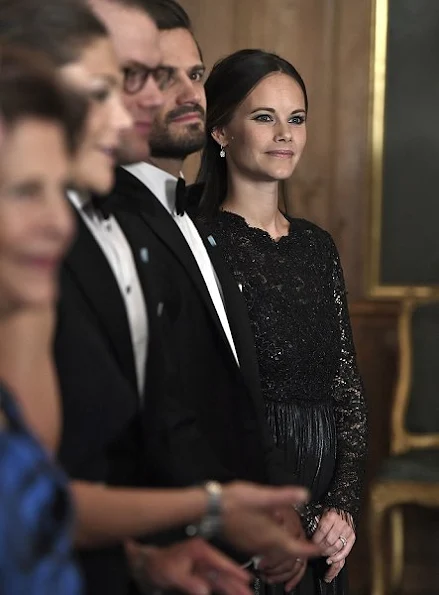 Crown Princess Victoria, Prince Daniel, Prince Carl Philip and Princess Sofia at Sverigemiddag. Princess Victoria wore Ann-Sofie Back dress style dress, gown. Crown Princess Victoria wore Ann-Sofie Back gown, Princess Sofia wore Kay Senchai gown