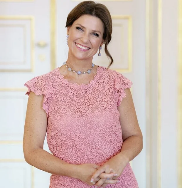 Princess Martha Louise wore a pink lace dress by Valentino. Emilio Pucci blue lace blouse. Crown Princess Mette-Marit wore the same dress