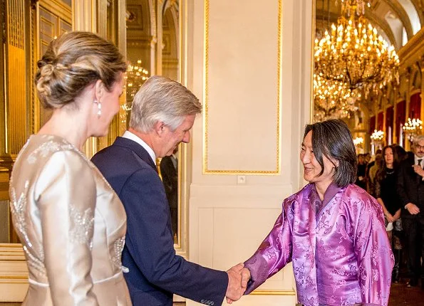 King Philippe and Queen Mathilde hosted traditional New Year reception at the Royal Palace. Queen wore Natan dress and pumps