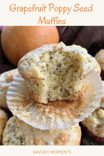 A grapefruit poppy seed muffin with a bite taken out of the side.