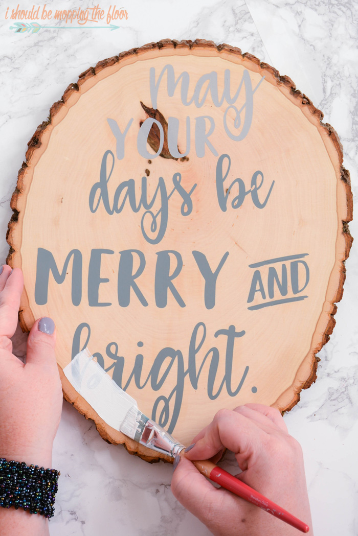 Christmas Wood Slice Art | Tutorial to create a fun and festive piece of holiday decor out of a wood slice.