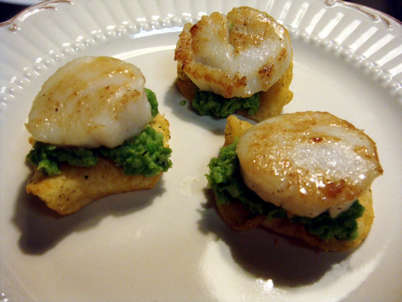 the little olive branch sea scallops with pea puree on potato chips