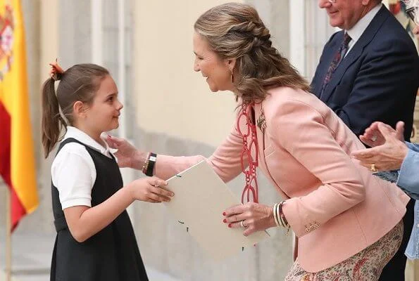 Infanta Elena of Spain wore Boss pumps and Mango pink jacket and Zara print trousers carried Mango clutch