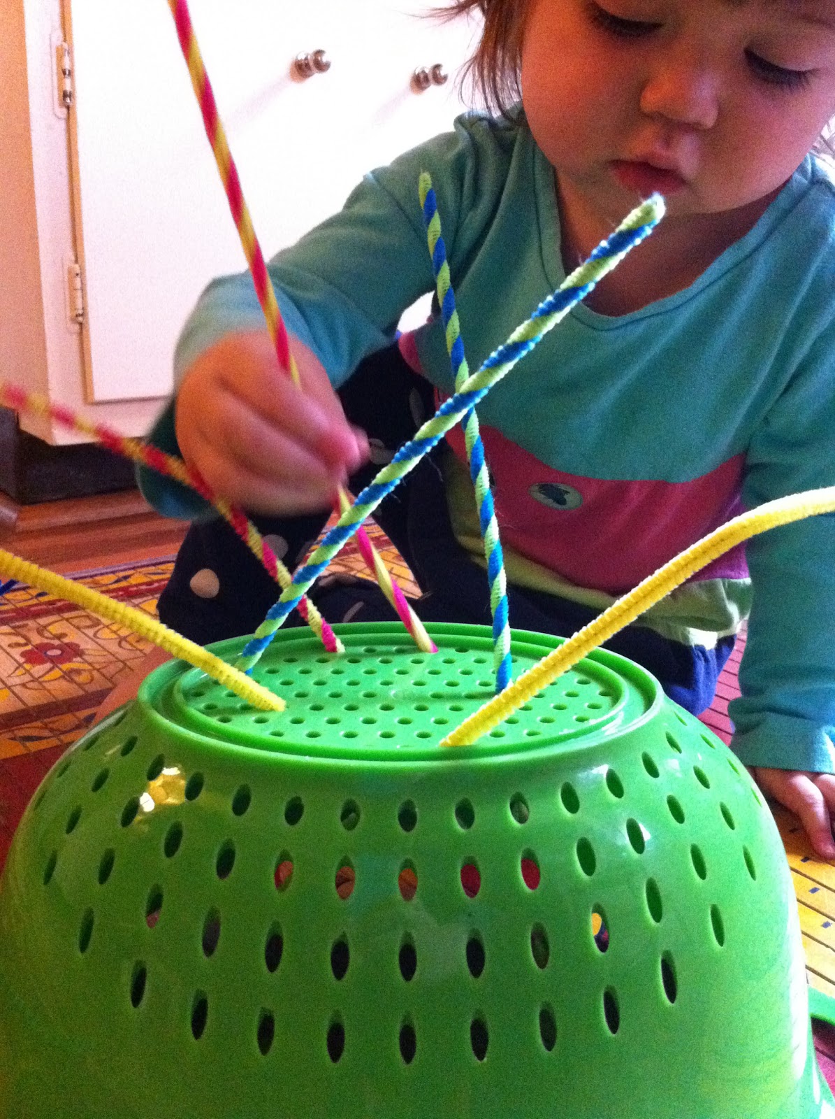 A Childhood List 29) Pipe Cleaner and Colander Play