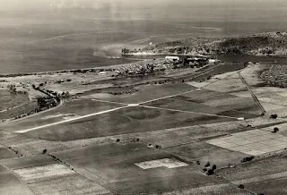 A shot of the Nasugbu Airfield with the sea in the background.  Image source:  United States National Archives.
