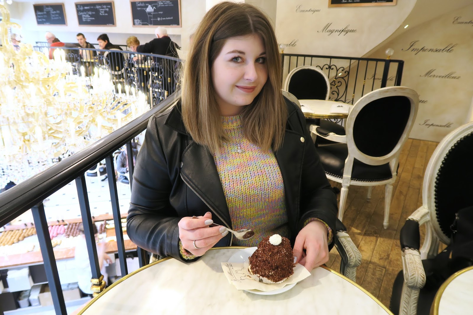 Posing with a Chocolate covered merveilleux cake in Bruges