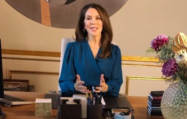 The Ministry of Education. Crown Princess Mary wore a dark blue self-tie wrap silk long sleeve blouse long sleeve top from Michael Kors