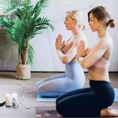 girls practicing vajrasana yoga asana