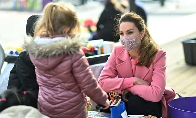 Kate Middleton wore a pink pure wool coat from Max & Co, and a pink scallop jumper from Boden