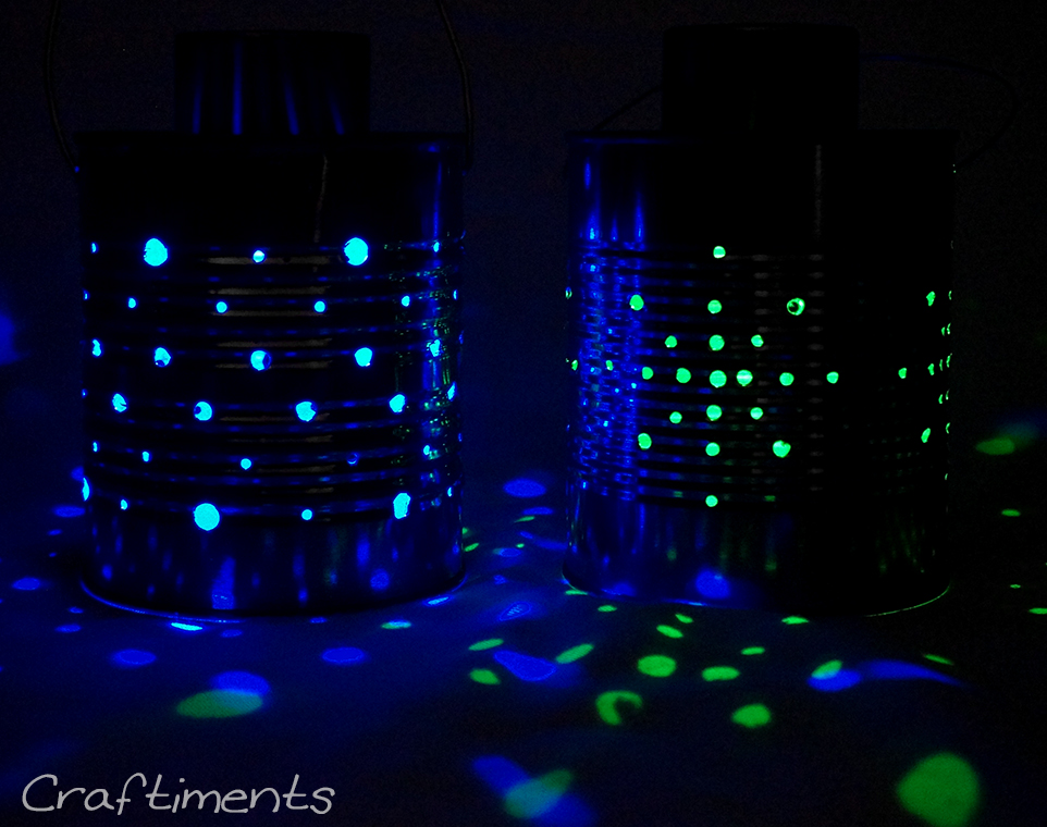 Tin can lanterns lit with color-changing solar lights.