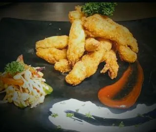 Garnished fish fingers with tartar sauce for fish finger recipe