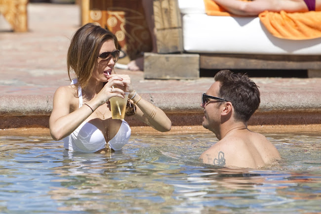 AUDRINA PATRIDGE cools off in the pool