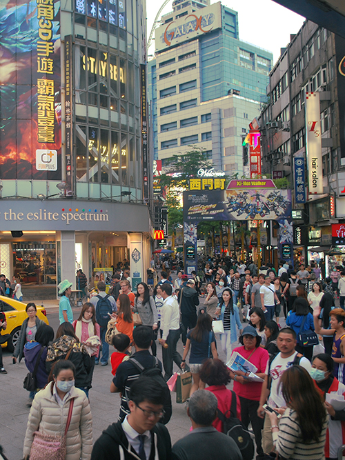 When you get out the right exit at Ximen station, you'll see a rush of people, and you suddenly don't know where you are. Ximen district, Taipei, Taiwan. 16 April 2015.