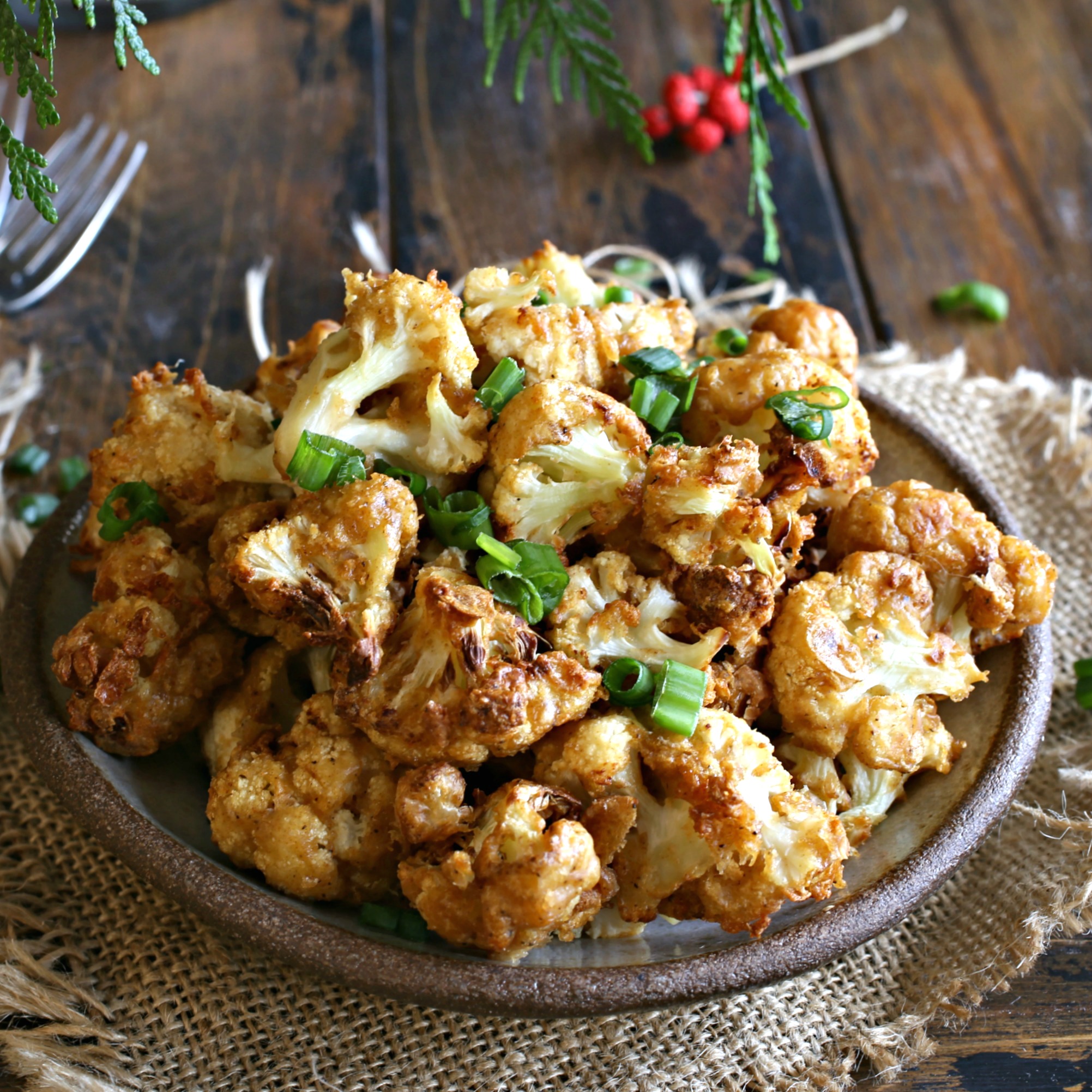 Recipe for cauliflower coated in a seasoned beer batter and cooked in an air fryer.