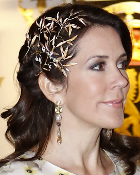 Crown Princess Mary wore a modern headpiece from 'Petit Frost' collection of Ole Lynggaard and Gianvito Rossi pumps, a Yves Saint Laurent clutch bag