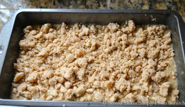 Sprinkle top of Orange Cranberry Bread batter with brown sugar crumb topping.