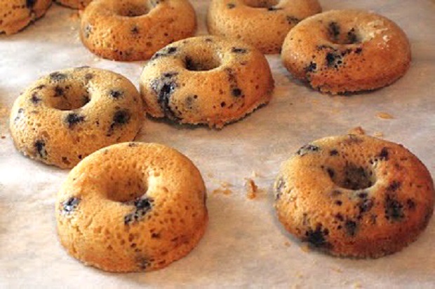 blueberry baked donuts on wax paper cooling