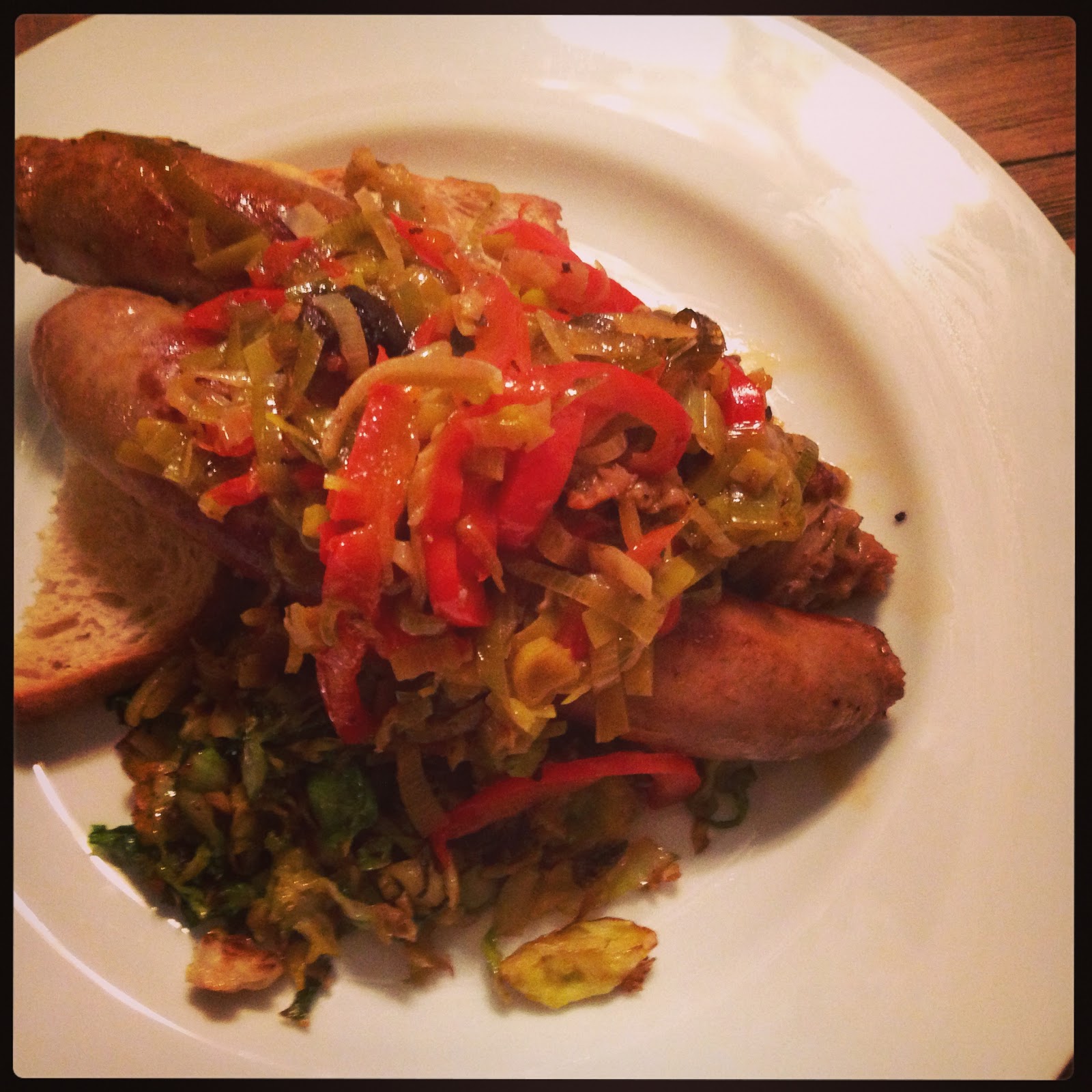 Ginger in the Kitchen Beer Braised Sausages with Leeks, Peppers, and