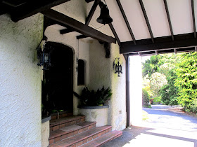 Entryway of an old arts-and-crafts-style building.