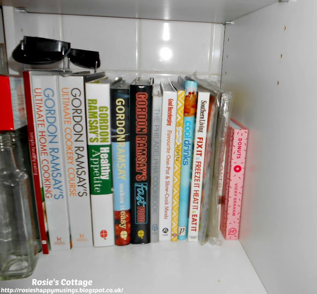 Kitchen Cabinet Re-Organisation: I've used the very back of the lower shelf of this deep cabinet to store my favourite cook books, they're easy to access and it keeps our counter top clear.