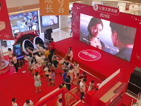 virtual reality ride and large video screen at Coca-Cola promotion in Bengbu, China
