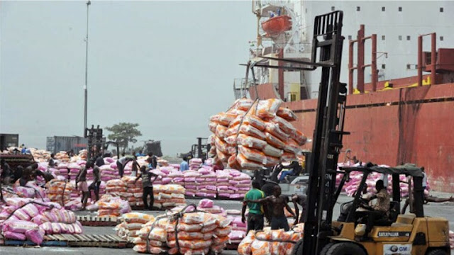 Alt: = agric export items being loaded into the ship at the seaport"