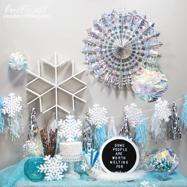 Frozen Inpsired Party with Blue Silver Snowflakes!   Frozen inspired party--or snowflake decorations to keep up for the rest of Winter! This Frozen inspired party is a fantastic balance between a child-like ice princess party and a grown up Winter Wonderland!     Whether it's a Frozen birthday party or just a fun Winter themed party, this party will keep giving all Winter long.