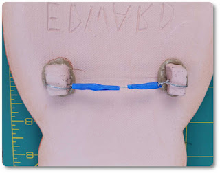 Wire hanger on back of artwork Back of ceramic artwork has built-in hanger