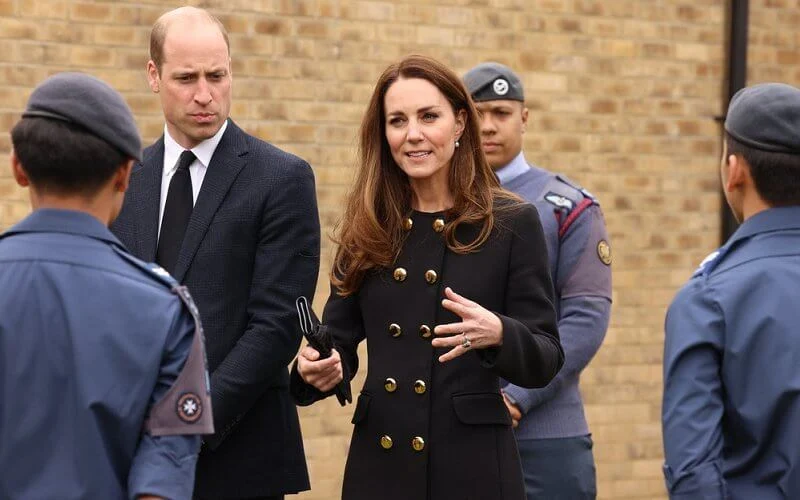 Kate Middleton wore a collarless long coat from Dolce & Gabbana, and suede pumps from Tod's. She carried Mulberry Bayswater clutch