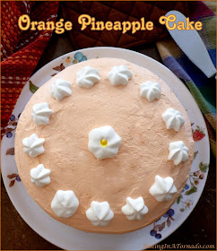 Crushed pineapple and orange juice flavor this Orange Pineapple Cake. Full of flavor, easy to make starting with boxed ingredients, beautiful to serve. | Recipe developed by www.BakingInATornado.com | #recipe #cake