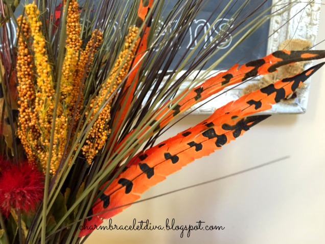 Fall foyer Dollar Tree faux flowers and feathers with fallart chalkboard