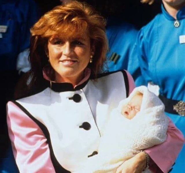 The newborn baby August was sporting a knit cap and sweater, a onesie with whales on it, and some sweet bunny slippers. Sarah Ferguson