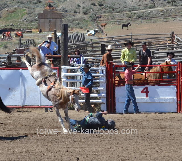 The rider is on the ground but moves quickly to get out of the way