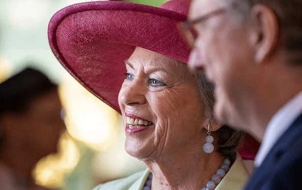 Princess Benedikte attended a lunch with the Danish Consul General in Flensburg. pearls earring and pearl necklace. Crown Princess Mary