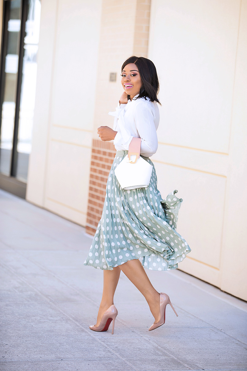 stella-adewunmi-of-jadore-fashion-in-pleated-pastel-polka-dot-skirt 