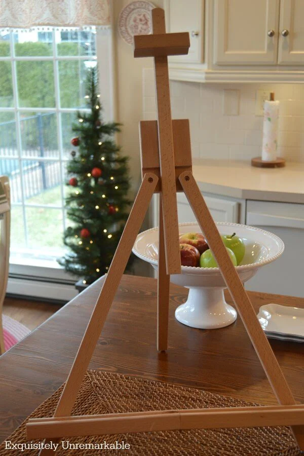 Mini Tabletop Easel on a table top at Christmas time with tree in background