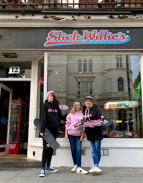 madmumof7 and daughters outside Slick Willie's skate shop in London