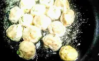 Frying chicken balls in a pan for chicken manchurian