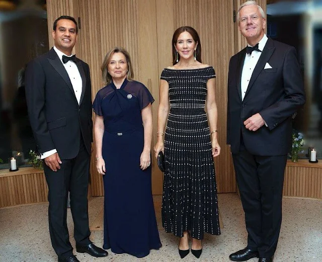 Crown Princess Mary wore a synthetic off-shoulder knit dress by Alexander McQueen. Jewlscph earrings. Cartier diamond bracelet