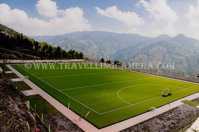 Hockey stadium at the Sports Authority of India's high-altitude training center is located around 50 km from state capital Shimla. Recently I was driving on highway which connect Shimla with Kinnaur and Shilaroo Hockey stadium came on left side of the road... And we thought of creating a quick PHOTO JOURNEY for folks on web !!!The Sports Authority of India Center, located at an altitude of 8000 feet and surrounded by picturesque Narkanda and Hatu peaks, has excellent indoor facilities for handball, volleyball, badminton, basketball, table tennis, fencing and wrestling apart from gymnasium and hostel facilities. Most of the other facilities were on other side of the main stadium. It was very well maintained and colorful stadium looks more magical with snow covered peaks in the background. Hills in the background are famous Hatu peaks...Shilaroo Stadium is ready to host practice sessions for domestic and national players... Shilaroo Stadium lies in Vidya Stokes' area, who is president of the Hockey India... It was really amazing to see a huge green stadium on such a height. Whole stretch is full of fruit orchards and no one can imagine that such a beautiful & huge hockey stadium will come on the way to Kinnaur...Some bikers were also waiting on other side of the stadium. It was lunch time for them :)Shilaroo Hockey Stadium is just 5-7 kilometers form Apples orchards of Vidya Stokes who is congress leader of Himachal Pradesh. She has also got some huge cold-store in Shilaroo only...The construction of the hockey stadium has drawn a lot of criticism, especially from the sport fraternity, for such a huge investment in an area where the temperatures remains below freezing point from mid-October to February. However, three-time hockey Olympian Pargat Singh thinks other wayAn MTB Cycle just outside Shilaroo Hockey Stadium !!!It's known that training in an oxygen-deficient environment increases the oxygen-carrying capacity of the blood. Practicing at such a high-altitude helps the players to utilize greater amounts of oxygen that will enhance their capabilities...Few of my friends wanted to have a photograph with Shilarro Hockey Stadium and here it is !!! Aneesh, Arjun, KK ...This whole campus belongs to Shilaroo Hockey Stadium. Now it has other indoor facilities as well. This building on hill top has a guest house and other game courts as well...Here is a board which indicated us about this Stadium, otherwise Stadium is not directly visible from main highway. Sorry for spraying black color in the bottom part of this photograph as an event-poster was hanging with this board and I didn't want to show that !!!
