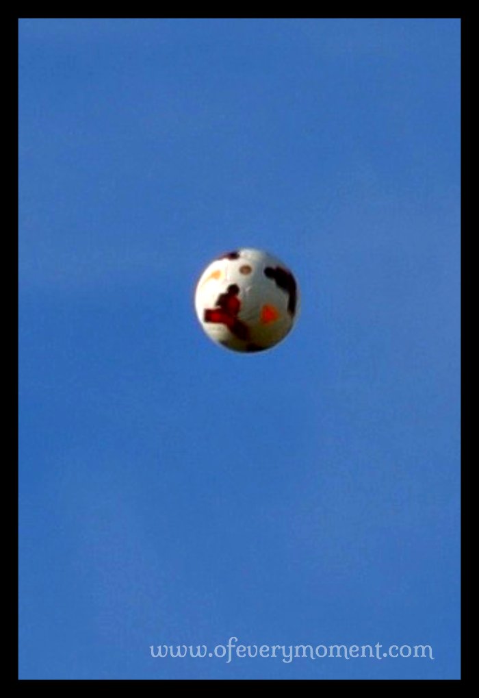 A soccer ball high in the air