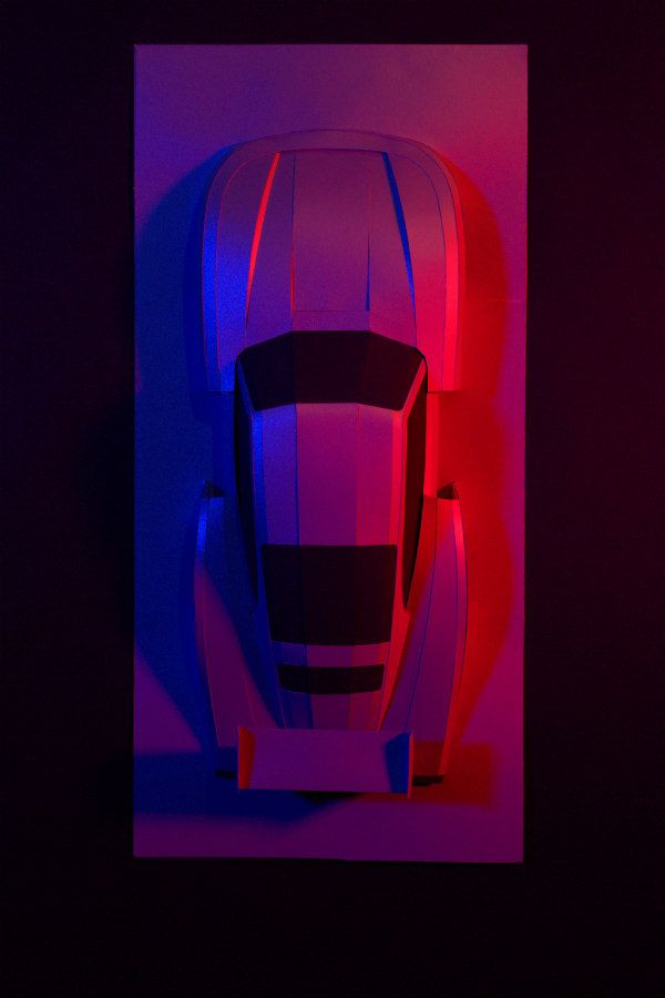 Porsche Whale Tail paper model sculpture with vivid red and blue lighting