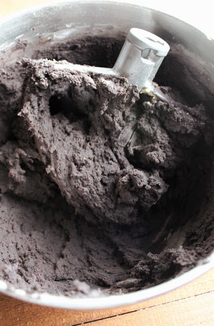dark chocolate sugar cookie dough in mixer bowl deep dark chocolate cookie dough in mixer bowl with paddle